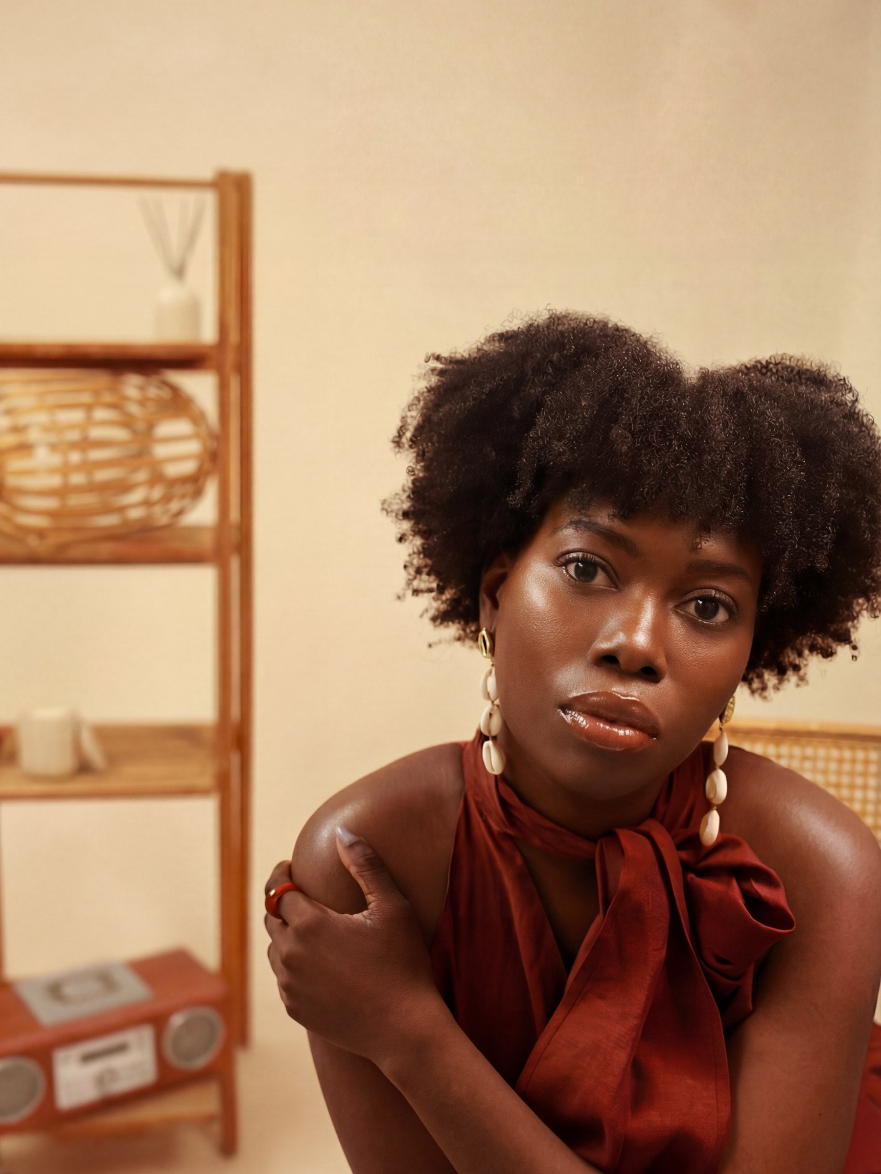 Victoria Songonuga, seated, in a warm daylit room